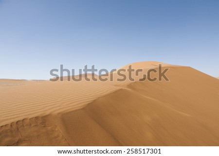 travel background with a sand dune in the Namib desert, Namib Naukluft Park, Namibia, Africa