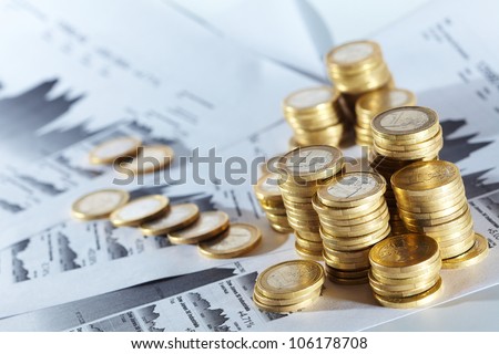 Business diagram on financial report with coins