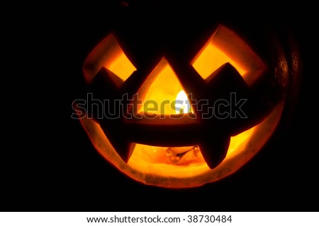 Creepy carved pumpkin face, with a smile