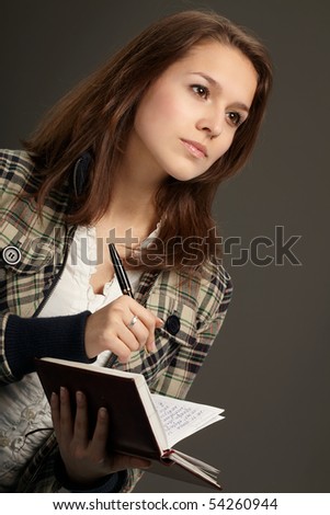 beautiful young woman with notebook