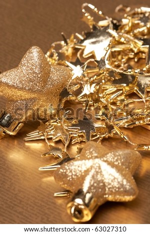 Christmas gold stars on the gold background