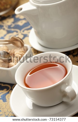 cup of tea with a teapot