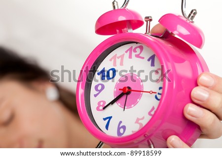 beautiful woman  and alarm clock