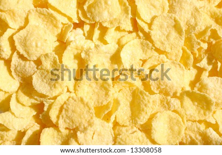 Sunlit and shady yellow cereal corn flakes background