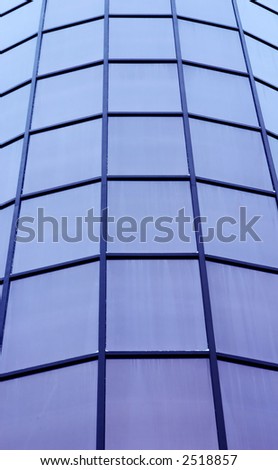 round facade of office building with plate black-out glasses