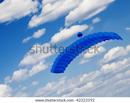 blue cloudy sky and soaring parachute