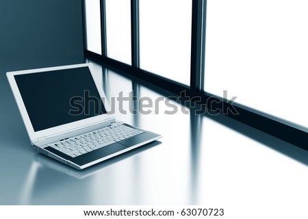 laptop on a smooth surface and light from a window