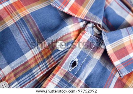 bright multi-colored plaid shirt with a collar