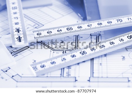 samples of architectural materials - plastics, metric folding ruler and architectural drawings of the modern house