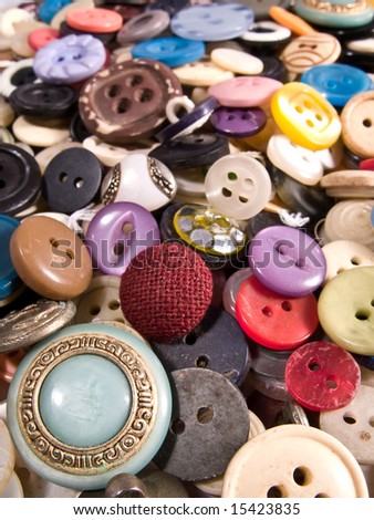Pile of old and used clothes buttons