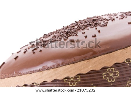 Chocolate fudge cake with sprinkles detail on white