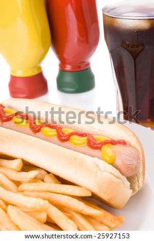 Fast food meal with hotdog, French fries and a cola