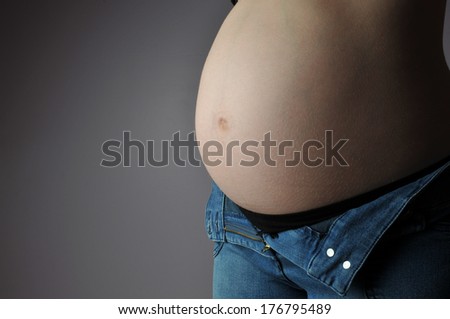 pregnancy belly with open jeans