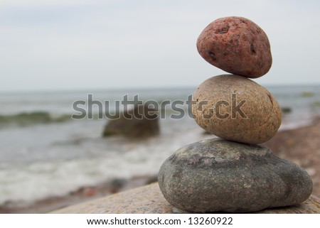 zen-like stone pile with the sea in background