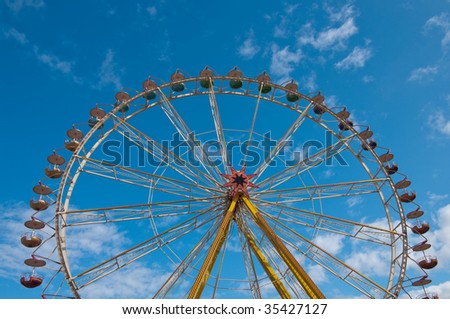 observation wheel under blue skies