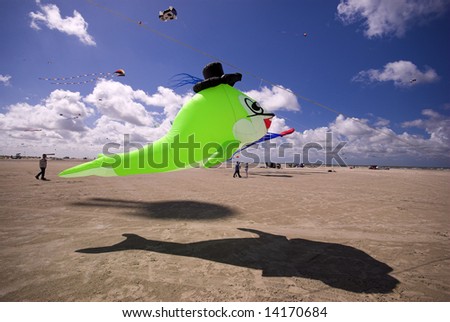 Hat on Neon Green Fish. Fantasy Kite in the Blue Sky a Sunny Day on the Beach. Kite Flying Festival on Fanoe, Denmark.