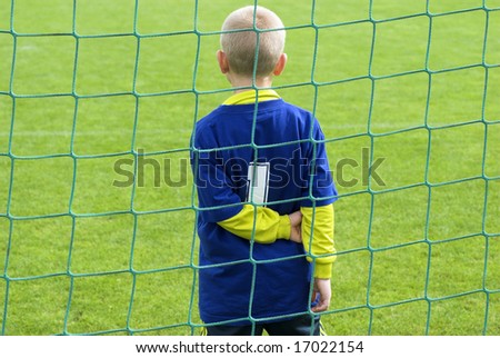 Number one goalkeeper. Young football goalkeeper with number one just on the goal line.