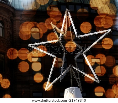Christmas star high up on Christmas market tent in Hamburg, Germany