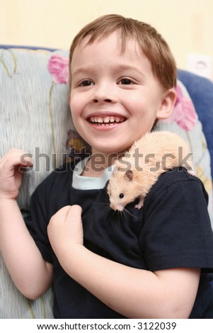 THE CHEERFUL BOY WITH THE HAMSTER ON THE SHOULDER