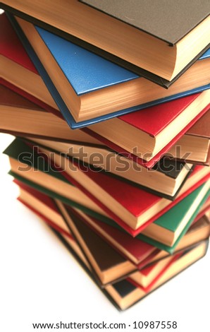 Many books lay on a white background