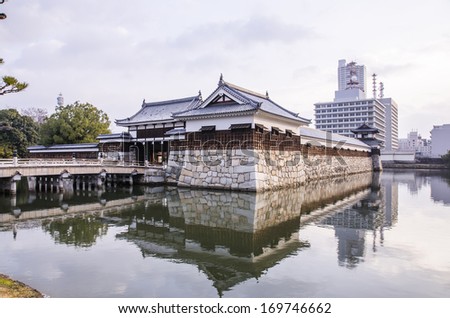 The bridge to entrance at hiroshima castle  with wall to protect from the enemy.