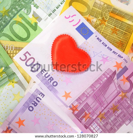 Red heart on euro money (Love for Money concept).