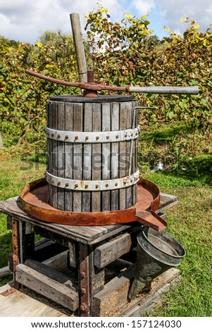 Antique wooden wine press left outside