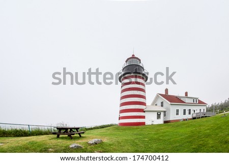 LUBEC-JULY 10: West Quody lighthouse in fogy day in Maine, USA on July 10, 2013.