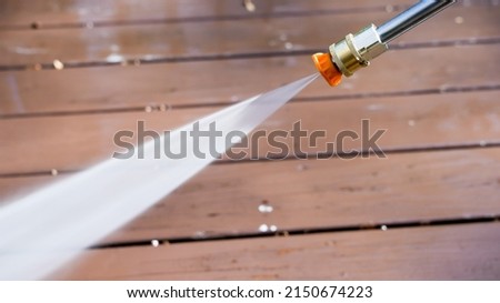 Cleaning deck with pressure washer detail with copy space Foto d'archivio © 