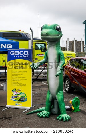 NORWALK, CT - SEPTEMBER 21: Gecko figure representing Geico  insurance at Norwalk boat show in September 21, 2014 in Norwalk, CT.
