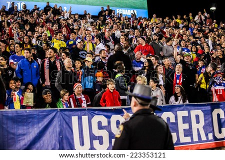 HARTFORD - OCTOBER 10: Security is searching for men who run to Maximo Banguera  on Friendly match between US Men`s National Team vs Ecuador,  on October 10, 2014, in Rentschler Field, Hartford, USA.