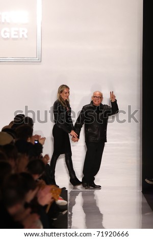 NEW YORK - FEBRUARY 15:   Max Azria with guest walks the runway for Herve Leger by Max Azria  collections Mercedes-Benz Fashion Week at Lincoln Centre on February 15, 2011 in New York.