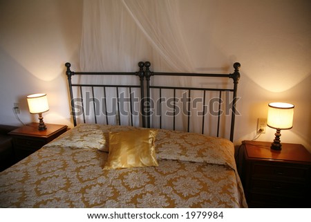 Iron bed - Italian hotel room.  Natural lightening.