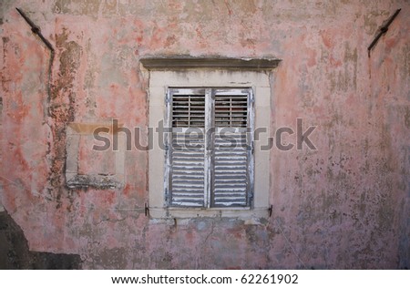 Beautiful facade with shuttered window seen in Dubrovnik - Croatia.