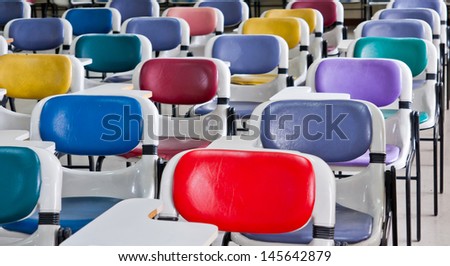 Multi colored chairs arranged in the room