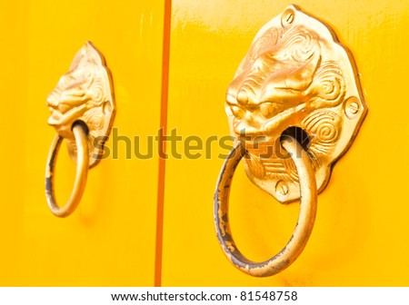 The yellow doors and door handles a lion