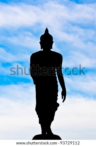 Silhouette of Buddha and the      blue sky clouds