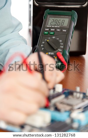 Technician repairing computer hardware in the lab .Small DOF