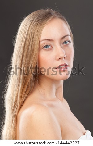 Close-up face portrait of young woman without make-up. Natural image without retouching .