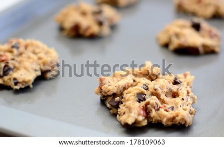 Closeup of spoonful of raw cookie dough ready to be baked