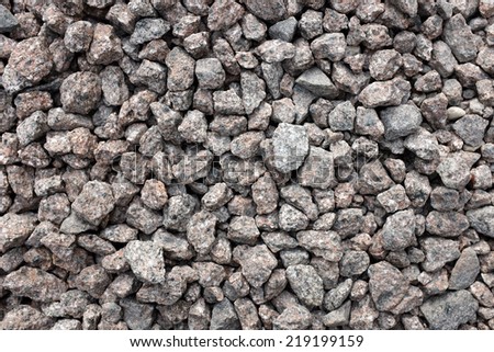 Crushed granite stone as an abstract background texture