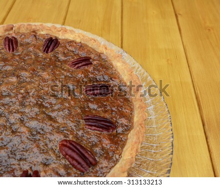 Close-up of home-made pecan pie decorated with toasted nuts