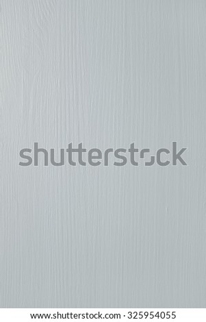 Wooden pine board painted gray, wood grain pattern shows through