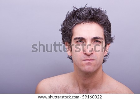 Young male with angry facial expression