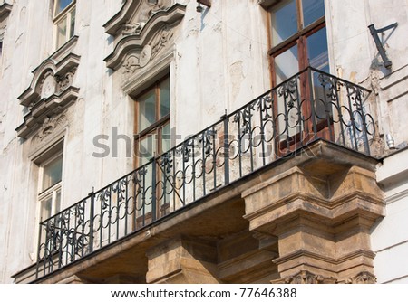 Balcony and facade of old and abandonned construction in East Europe
