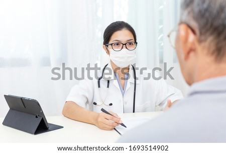 Similar – Image, Stock Photo caucasian doctor wearing protective mask and gloves indoors. Using an alcohol gel or antibacterial disinfectant. Hygiene and corona virus concept