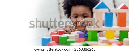 Similar – Image, Stock Photo Toddler playing with a colorful plastic bug toy; using hands to manipulate small object developmental milestone