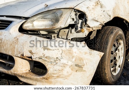 The front bumper of a crashed car.