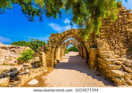 Sunny spring day. Arched passage - covered street. Picturesque ruins of the ancient seaport Caesarea. Israel. Concept of ecological and historical tourism ストックフォト © 