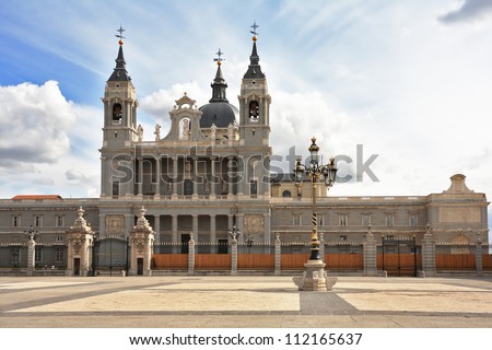 The magnificent Royal Palace in Madrid. The huge stone paved area in front of the castle and the lights in the Baroque style
